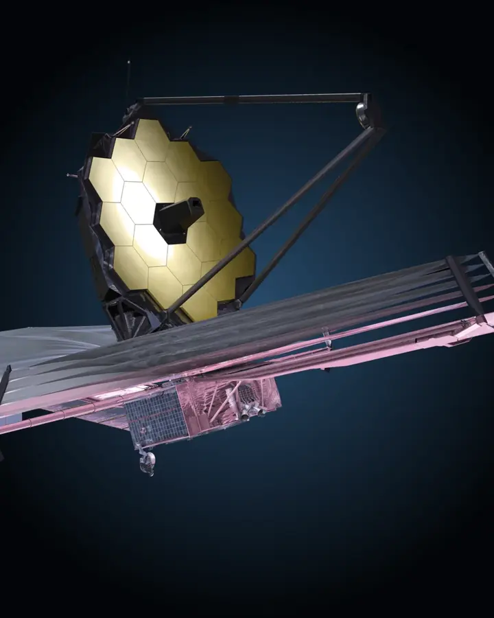 James Webb Space Telescope rendered against deep blue space