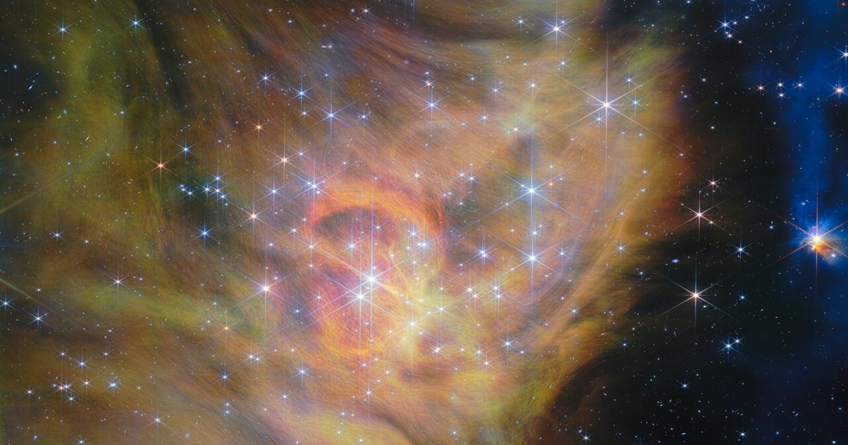 Near-infrared image of the star-forming region IC 348 in Perseus captured by the James Webb Space Telescope's NIRCam, showing clouds of gas and dust, bright stars and glowing jets from protostars.