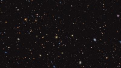 Webb NIRCam deep field crop of the GOODS-South region from the JADES survey, showing thousands of distant early-universe galaxies.